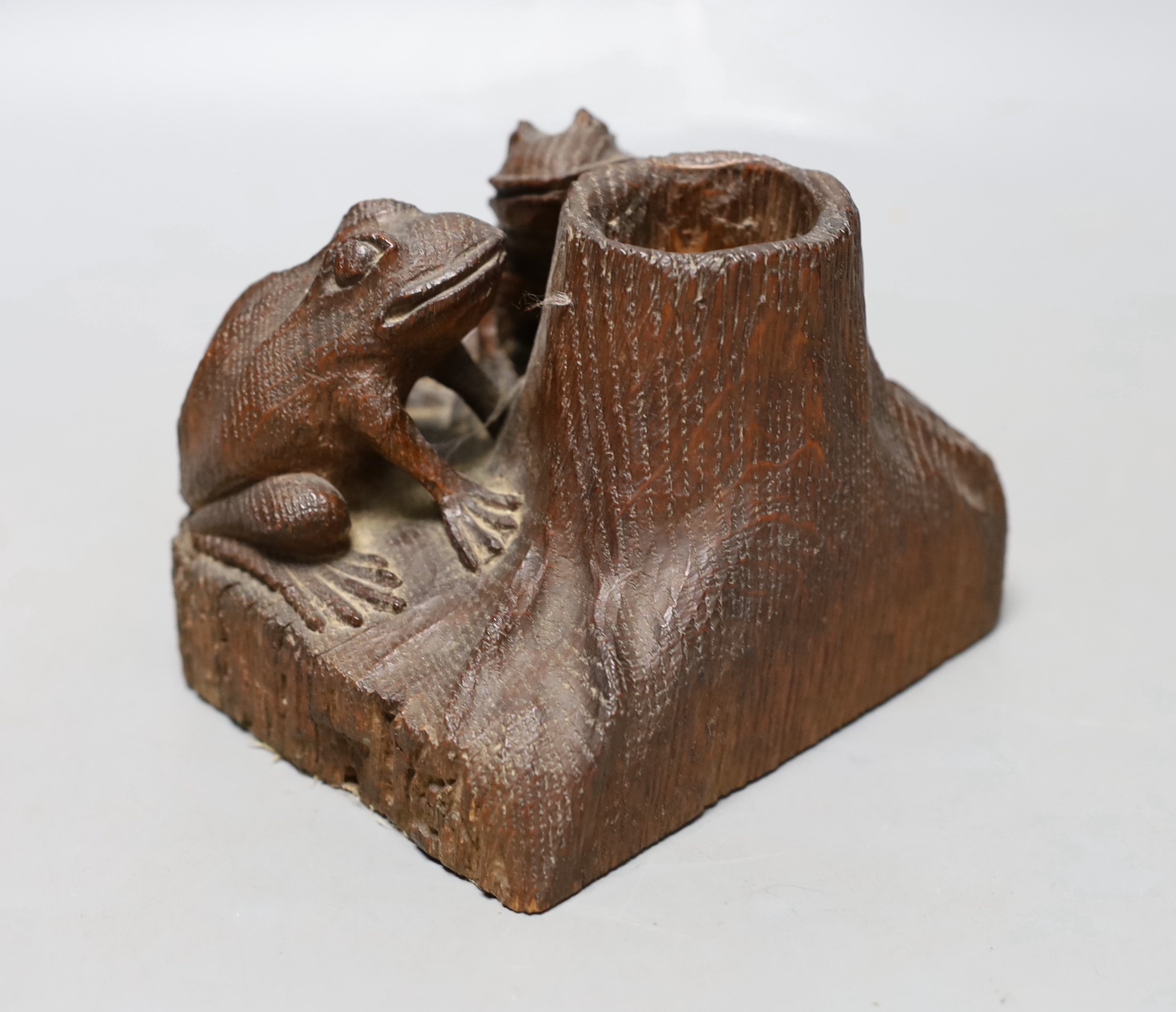 A carved oak ‘frog’ spill vase or inkwell holder, 10cm tall